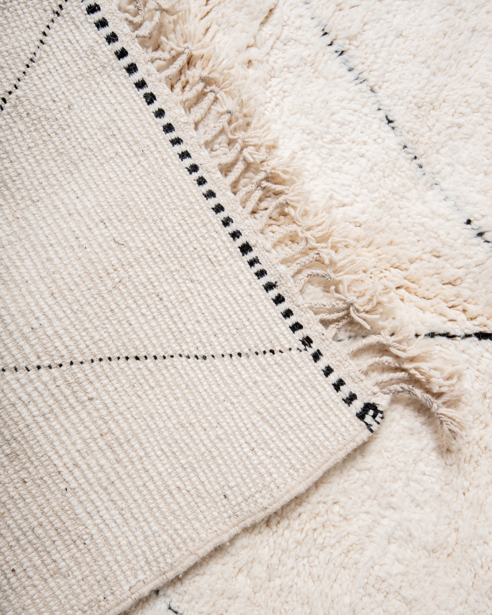 Modern, designer, handcrafted Berber rug from Morocco. Beniourain carpet with beautiful colours and patterns and fluffy wool texture.